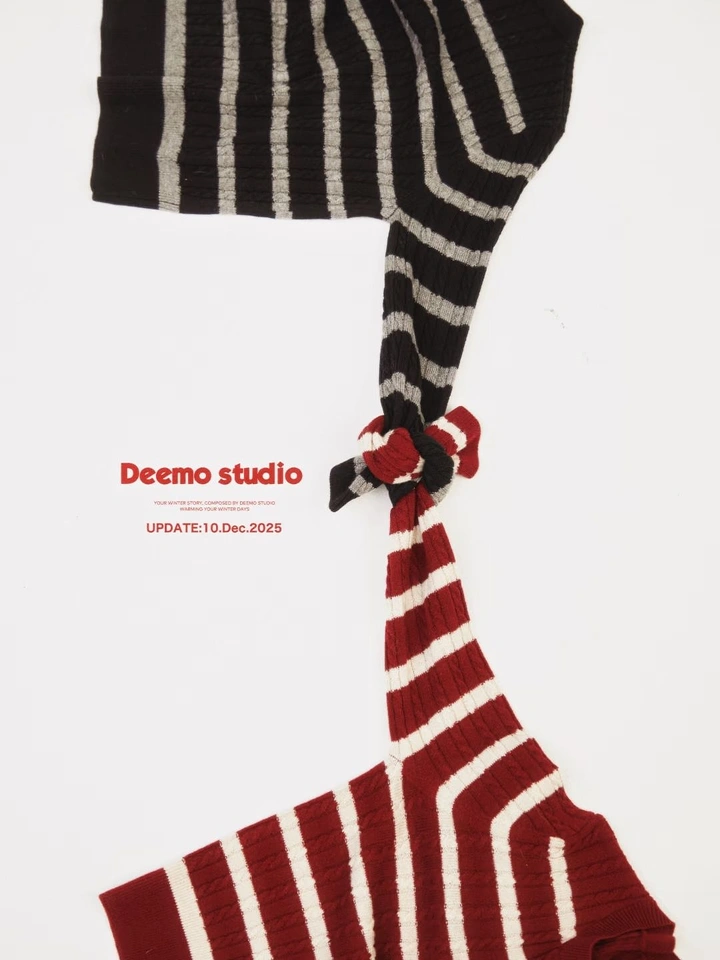 Creative ad: Two striped knit sweaters tied together by the sleeves