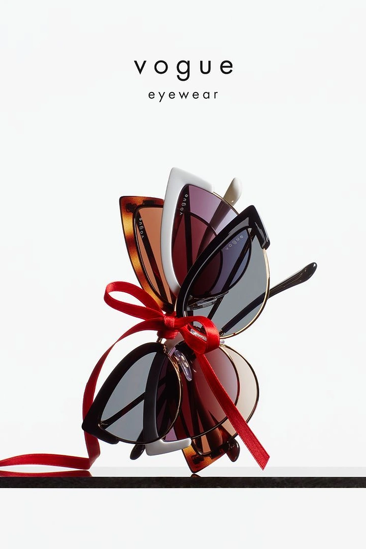 Opticians & Eye Care creative ad: Stacked sunglasses tied with ribbon as gift