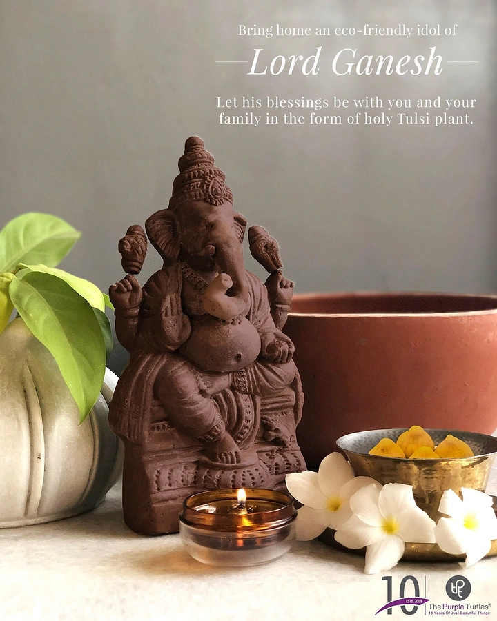 Ganesh Chaturthi creative ad: Eco-friendly terracotta Ganesha idol styled with a candle and flowers