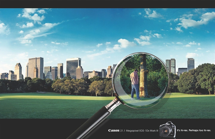 Cameras & Camera Stores creative ad: Lens metaphor frames distant city scene
