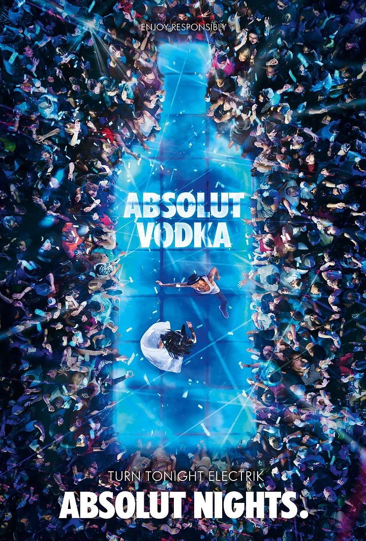 Creative ad: Top-down nightclub crowd surrounding a glowing blue dance floor shaped like a bottle