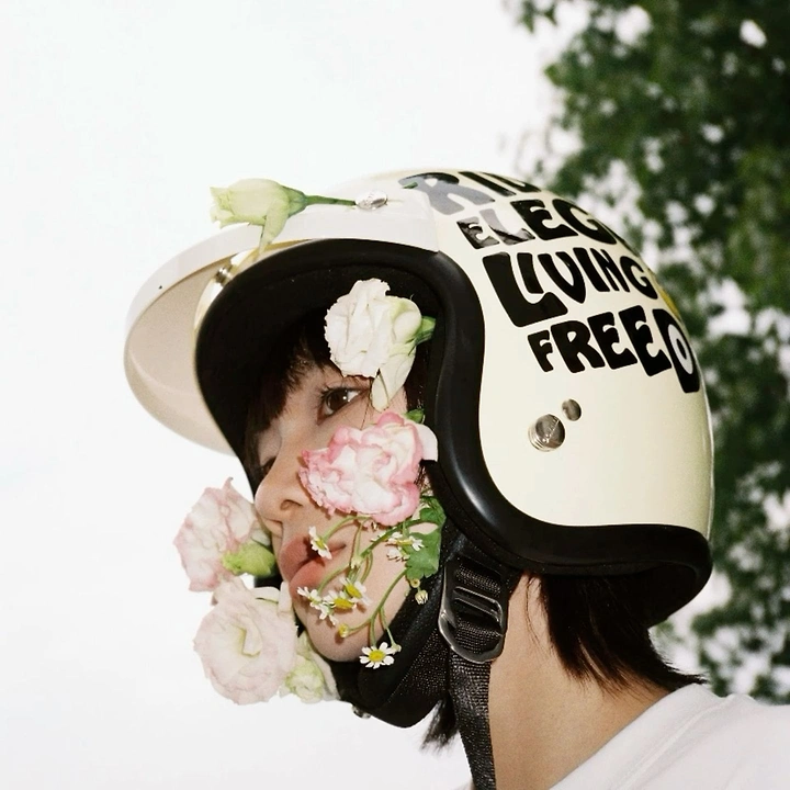 Helmets & Riding Gear creative ad: Helmet paired with flowers and freedom copy