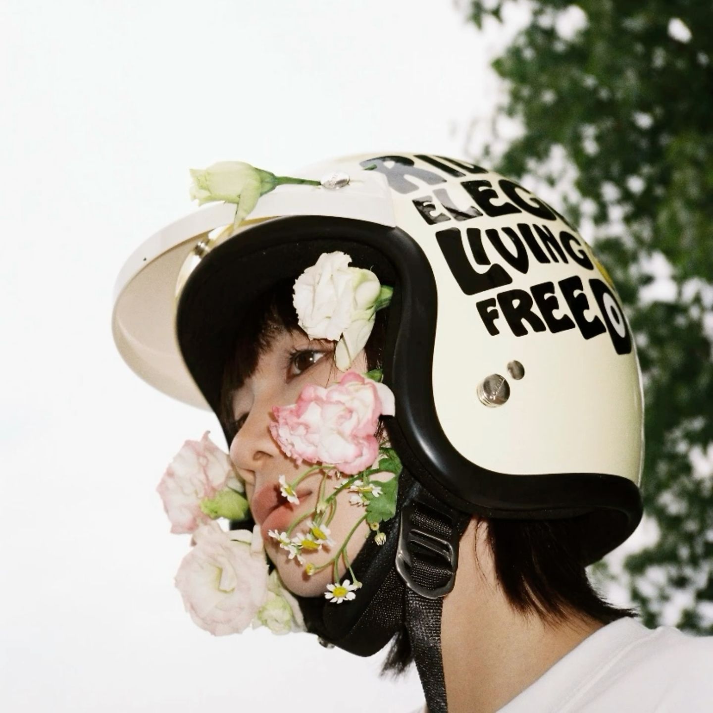 Instagram post: Helmet paired with flowers and freedom copy