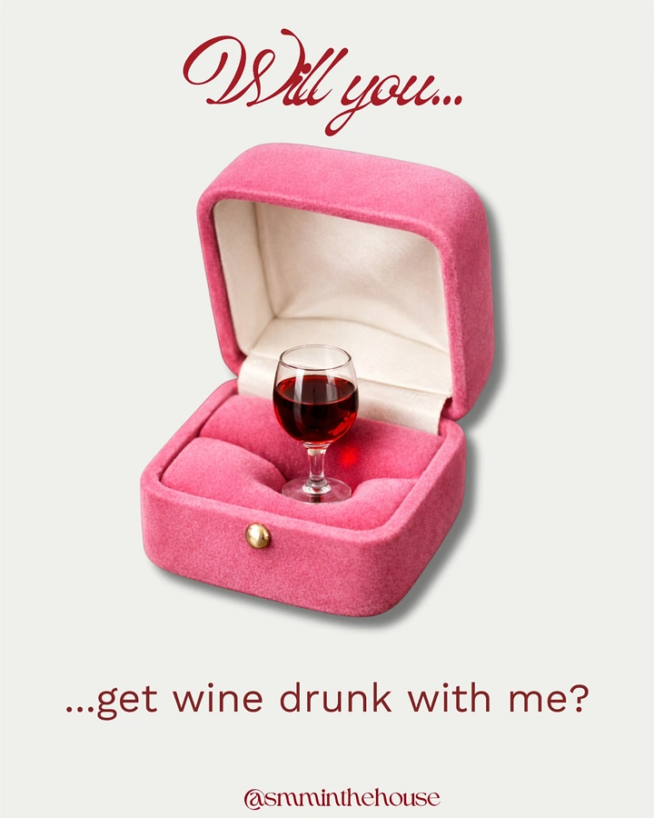 Valentine's Day creative ad: Mini red wine glass inside a pink velvet ring box