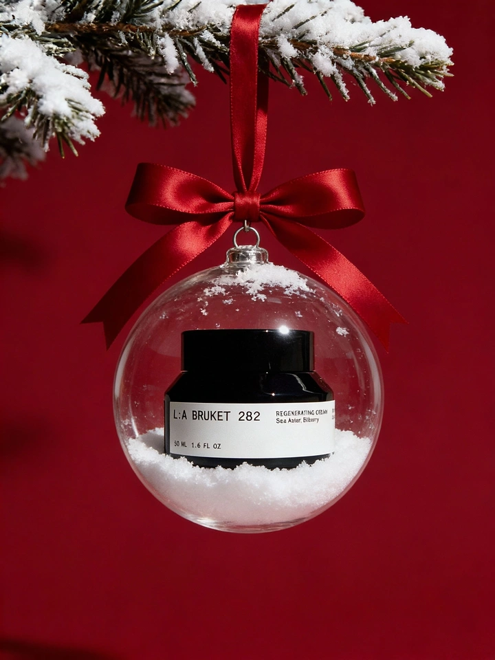 Beauty & Salon creative ad: Skincare jar inside a clear glass Christmas bauble filled with snow
