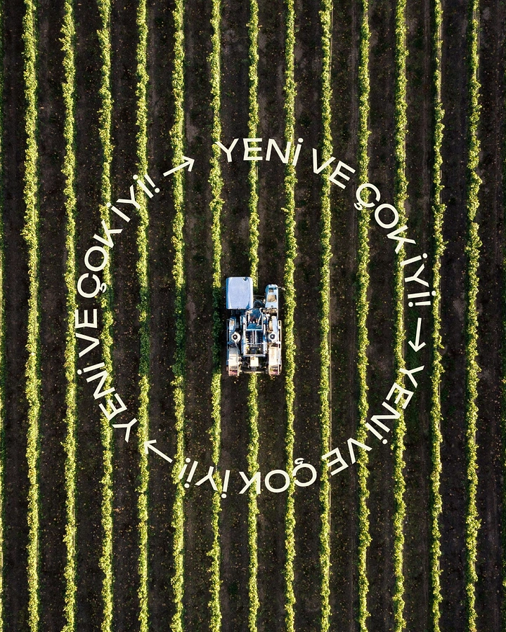 Agriculture, Seeds & Fertilizers creative ad: Top-down drone shot of a harvester tractor between vineyard rows