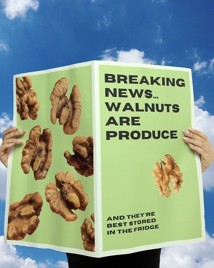 Dry Fruits & Nuts creative ad: Hands holding an open green newspaper covered in walnuts against blue sky
