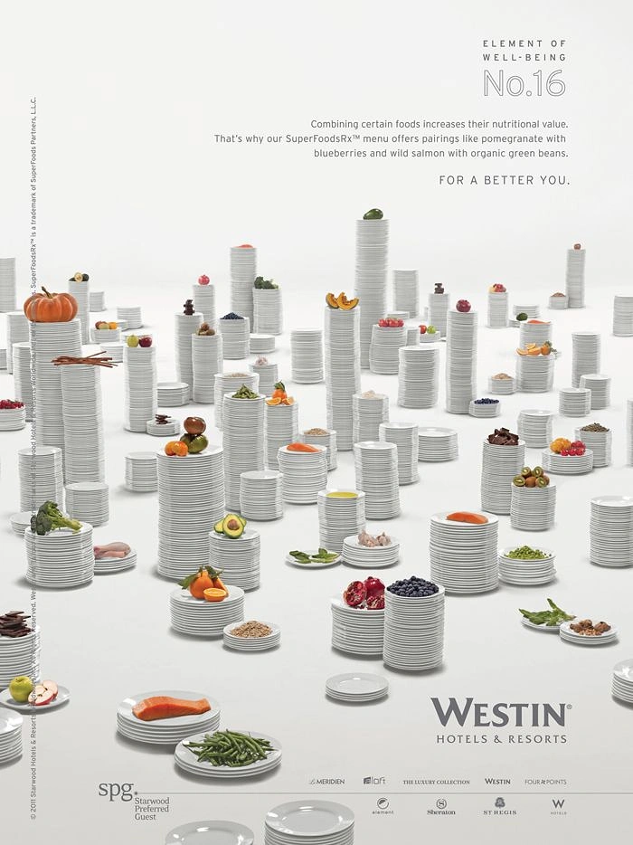 Hotel & Hospitality creative ad: Field of stacked white plate towers topped with superfoods