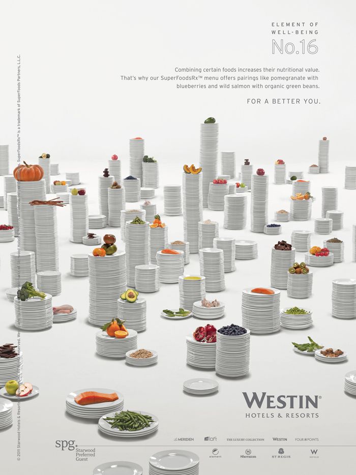 Field of stacked white plate towers topped with superfoods