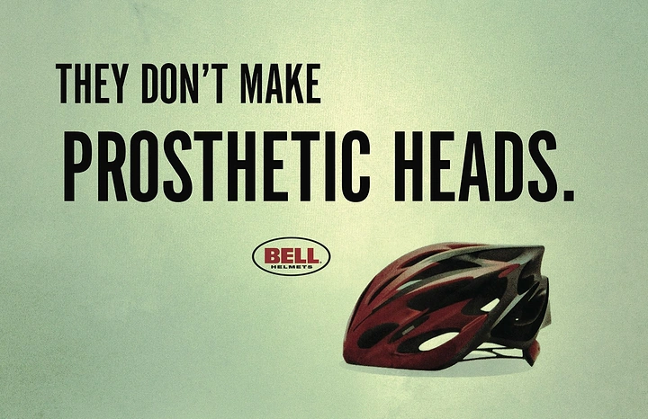 Helmets & Riding Gear creative ad: Red and black bicycle helmet on a pale green ground