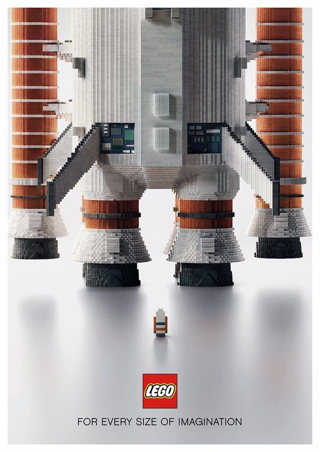 Toy Stores creative ad: Giant brick-built rocket towering over a tiny astronaut figure