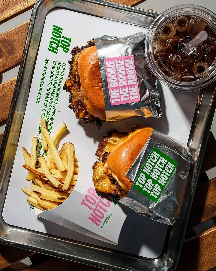 BBQ & Grill Restaurants creative ad: Playful packaging-led burger presentation