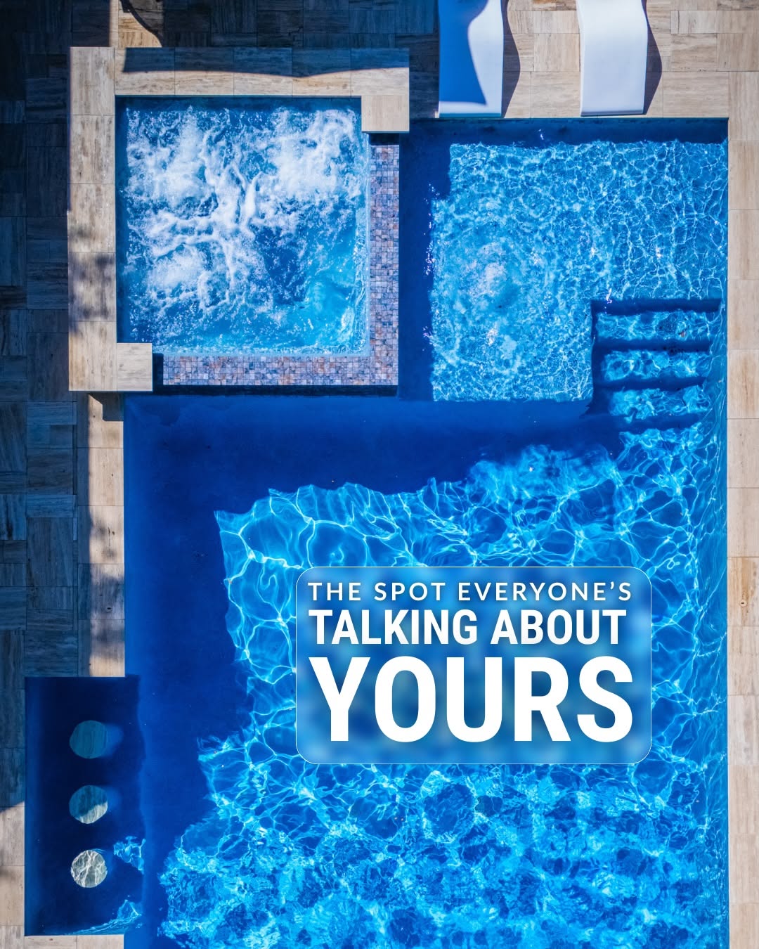 Carousel: Top-down drone view of a luxury pool with an attached spa, slide 1
