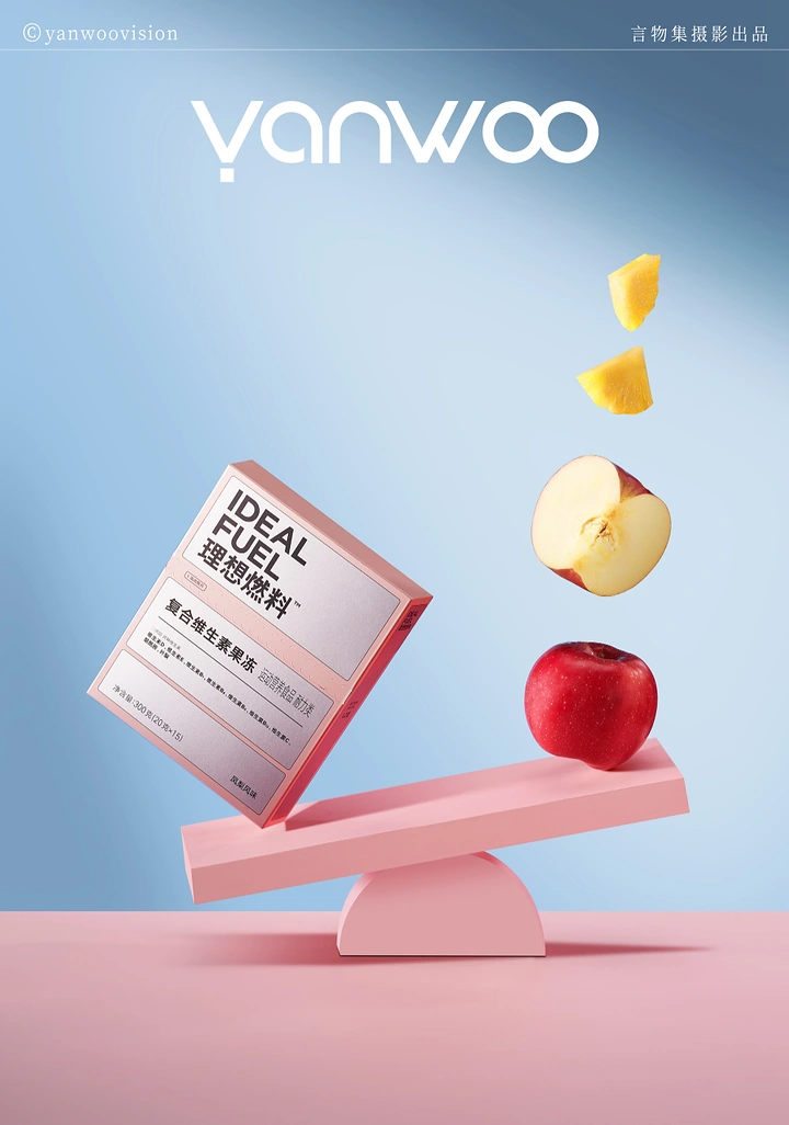 Nutritionists & Dietitians creative ad: Pink product box balanced on a seesaw against an apple and floating fruit pieces