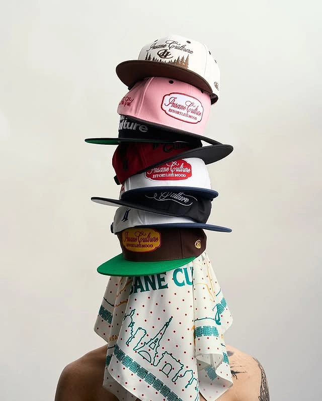 Hats & Caps creative ad: Unexpected human hat tower composition
