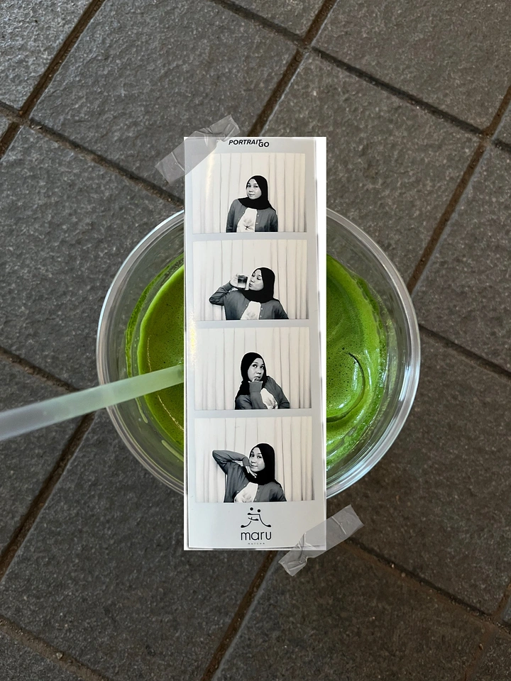 Photo Booth Rentals creative ad: Photo strip staged with a cocktail