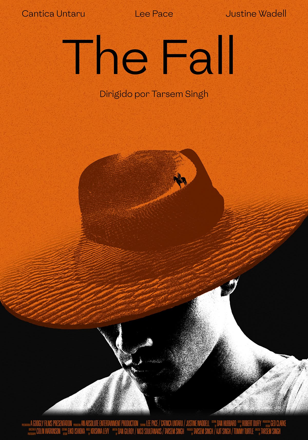 Poster: Man's face shadowed under a hat made of orange desert dunes