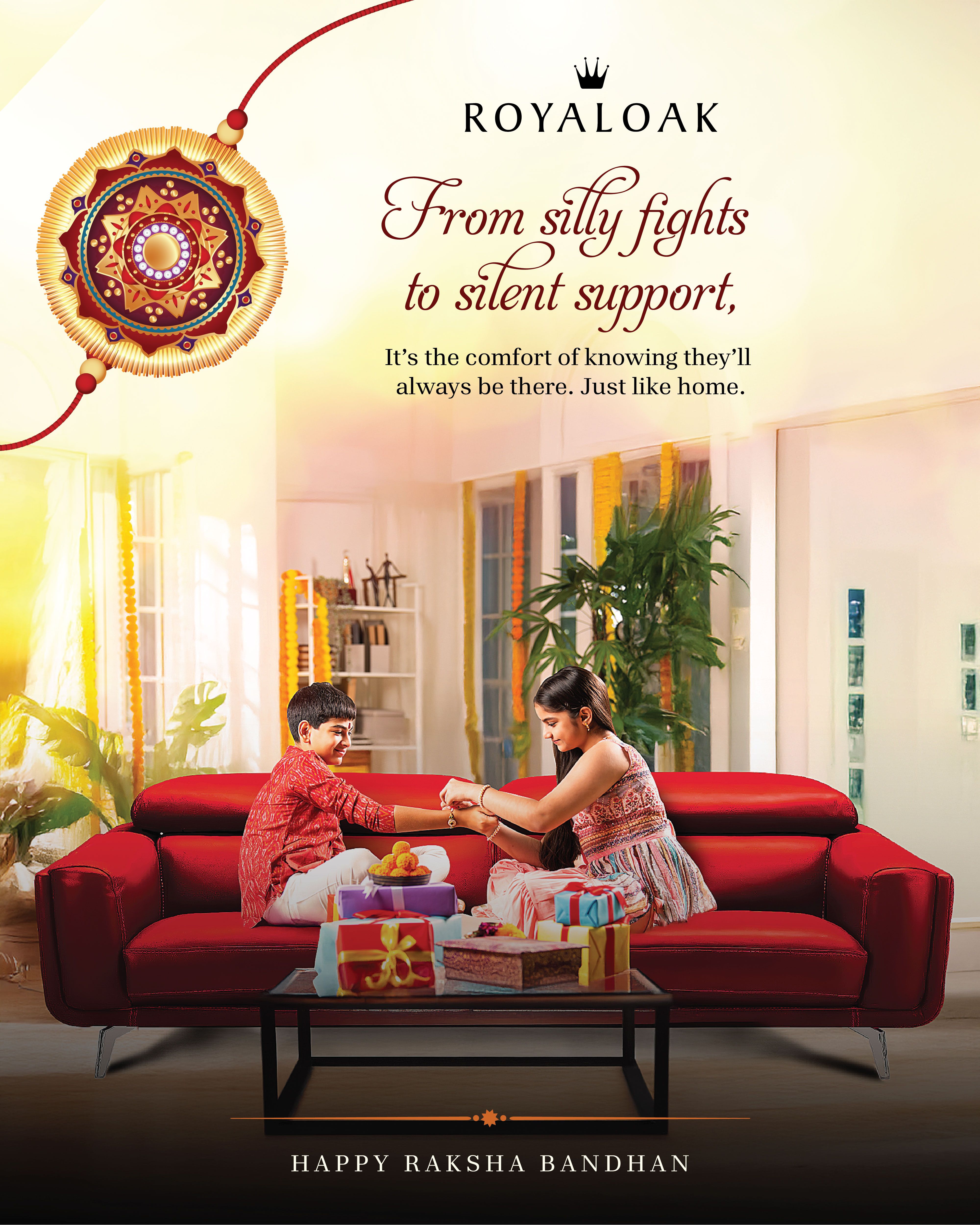 Siblings tying a rakhi on a red leather sofa in a sunlit living room