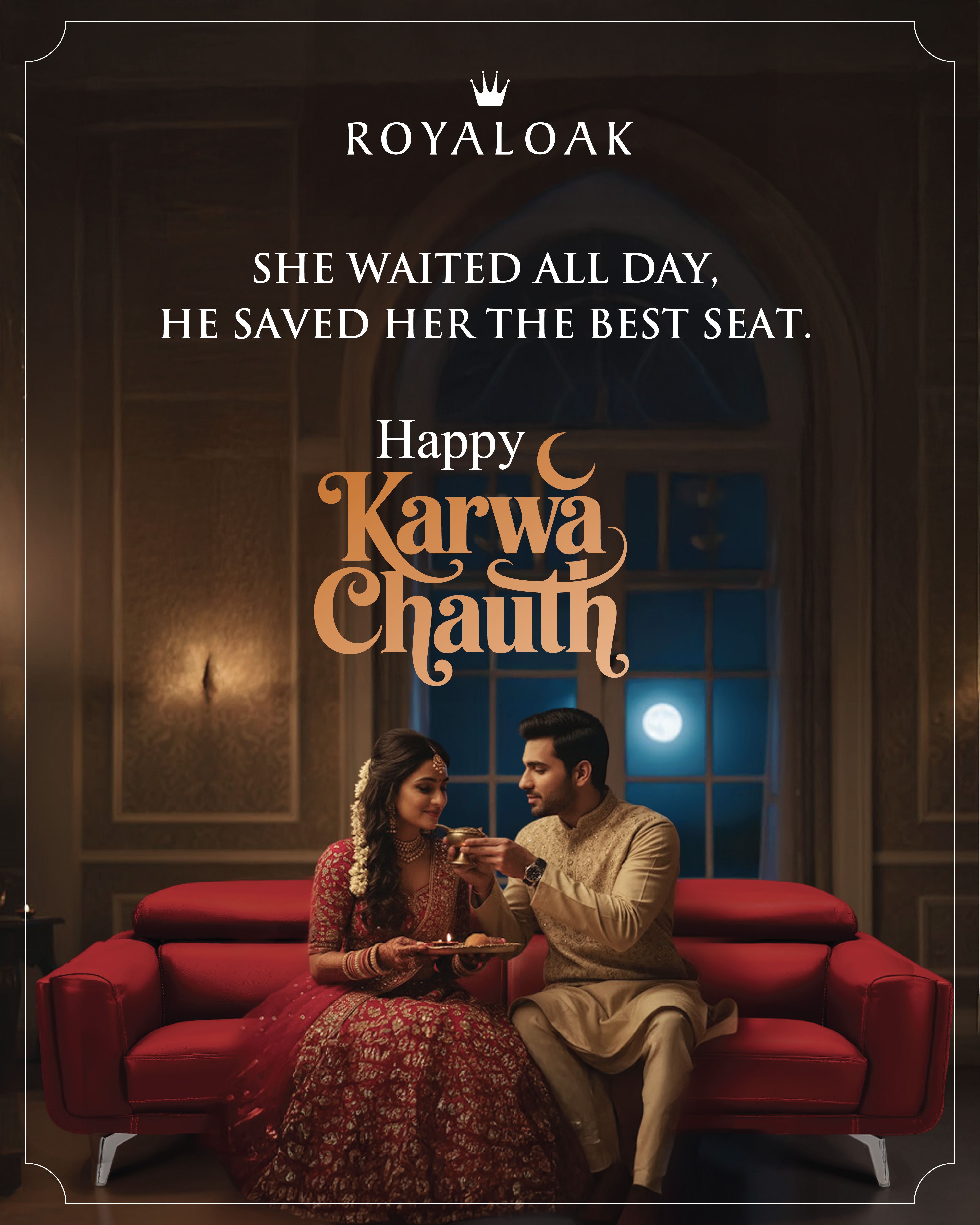 Couple in festive attire on a red sofa, husband offering water to wife