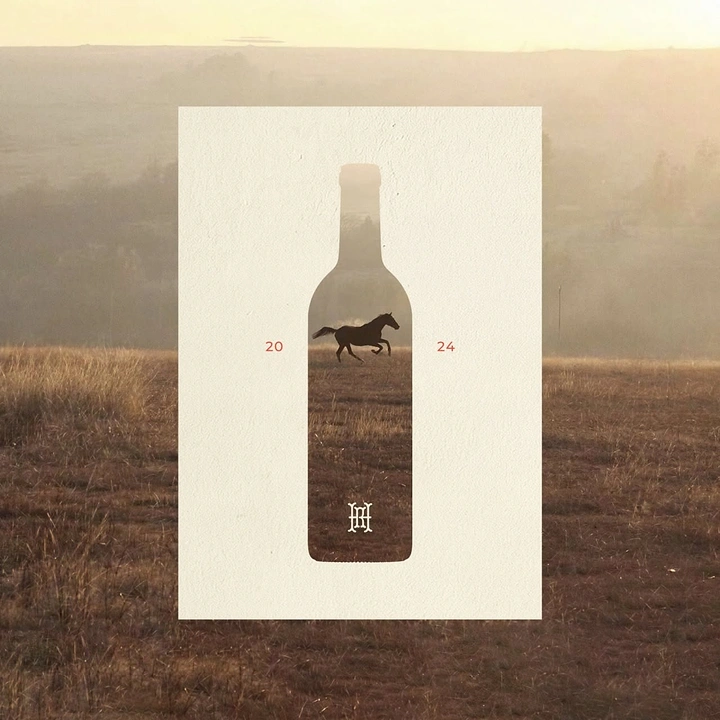 Creative ad: A bottle-shaped window revealing a galloping horse in a field