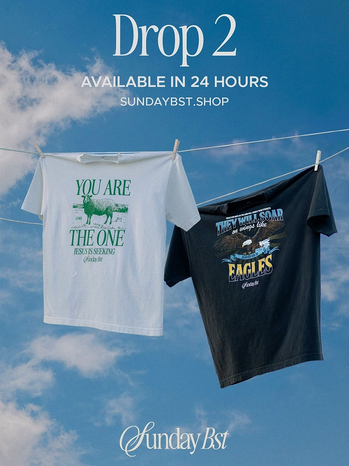 Print-on-Demand & Merch creative ad: Two faith-themed graphic t-shirts, one white and one black, pegged on a clothesline against a blue sky