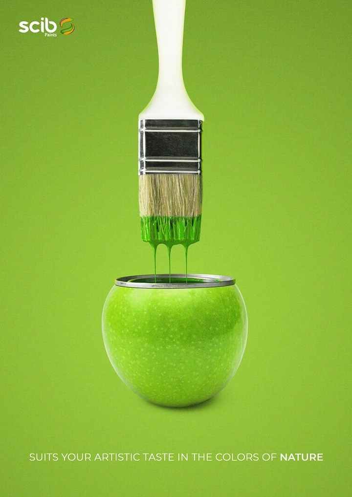Creative ad: Paintbrush dripping green paint into an apple shaped like a paint can