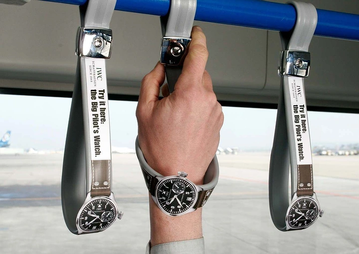 Watches & Accessories creative ad: Bus grab-handles turned into watch straps worn on a hand