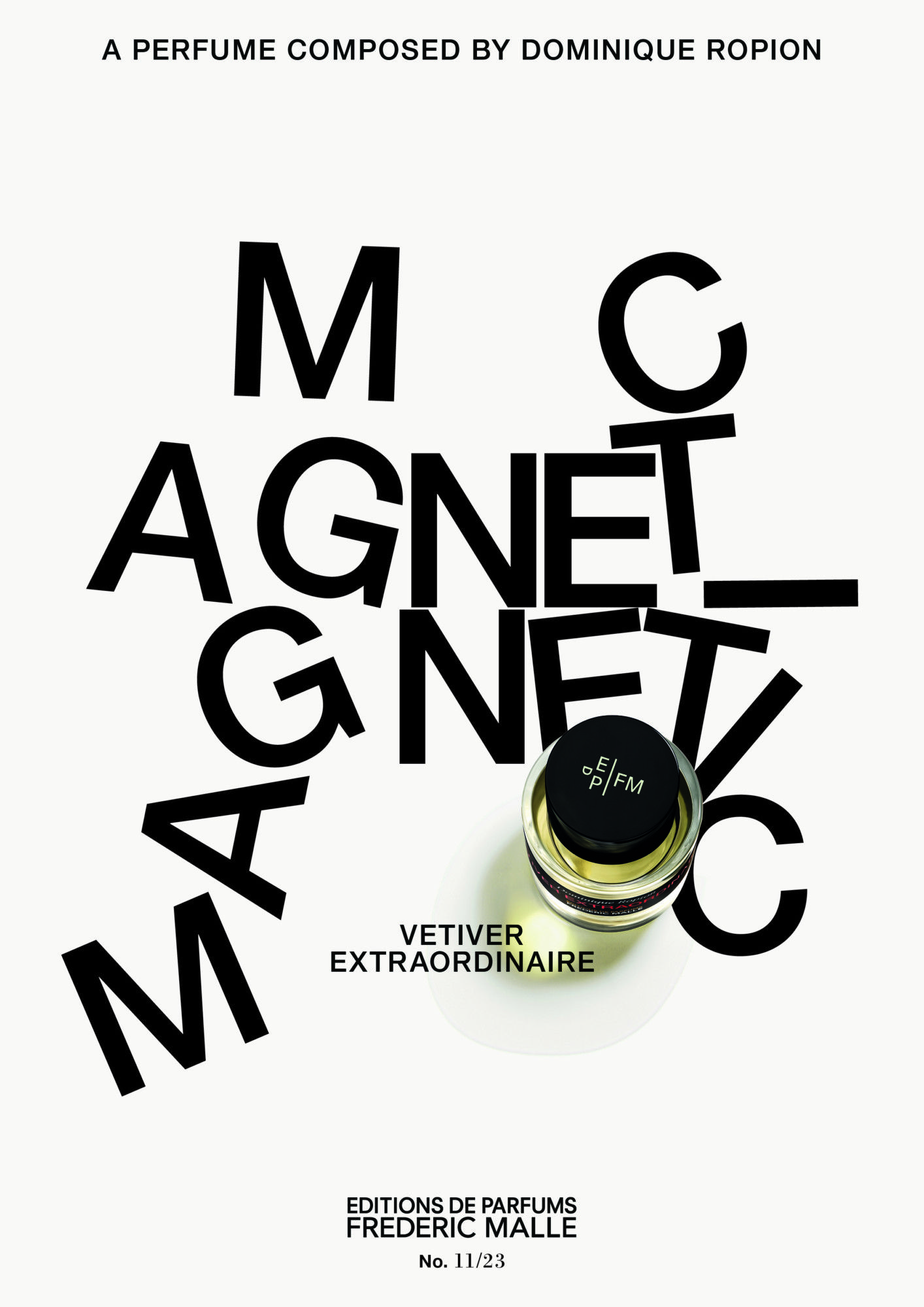 Top-down perfume bottle among the letters of 'MAGNETIC' scattered as if pulled by a magnet