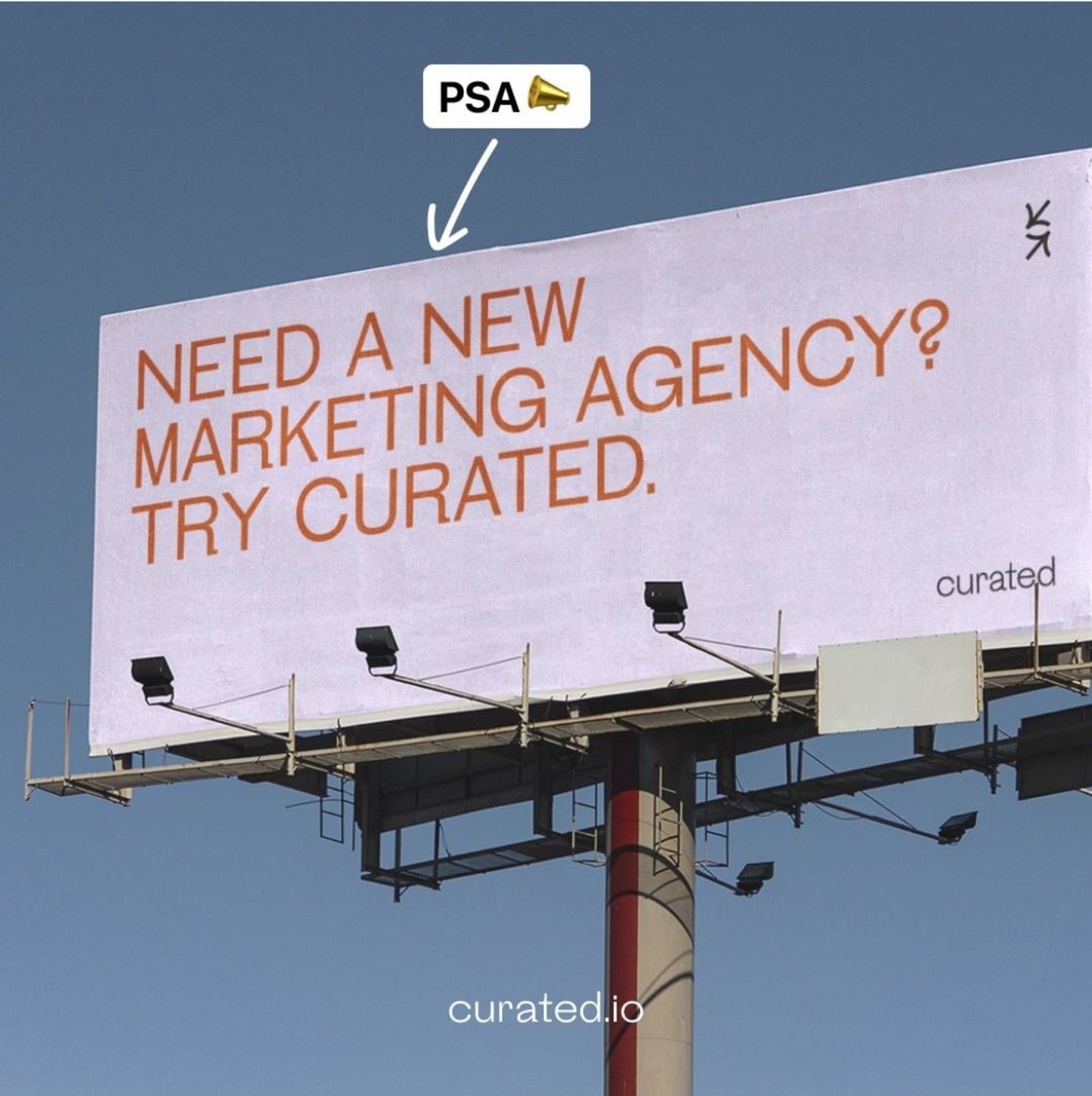 Roadside billboard against clear blue sky