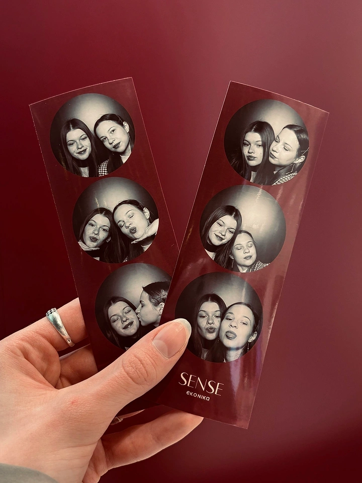 Photo Booth Rentals creative ad: Portrait prints arranged as tokens