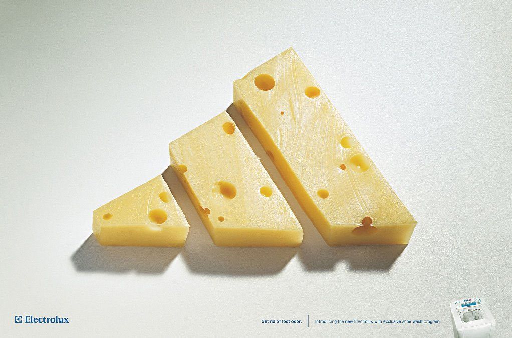 Banner: Three wedges of Swiss cheese arranged as a sneaker-brand three-stripe logo