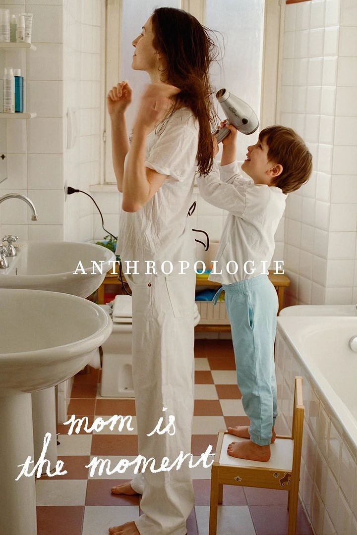 Mother's Day creative ad: Child standing on a stool blow-drying mother's hair