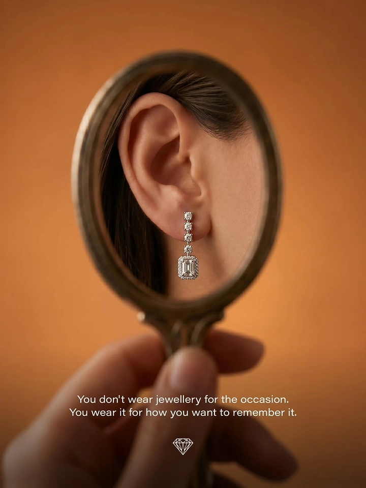Creative ad: Hand-held antique mirror reflecting an ear with a diamond drop earring