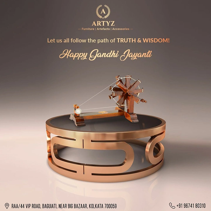 Gandhi Jayanti creative ad: Wooden charkha on a rose-gold round coffee table