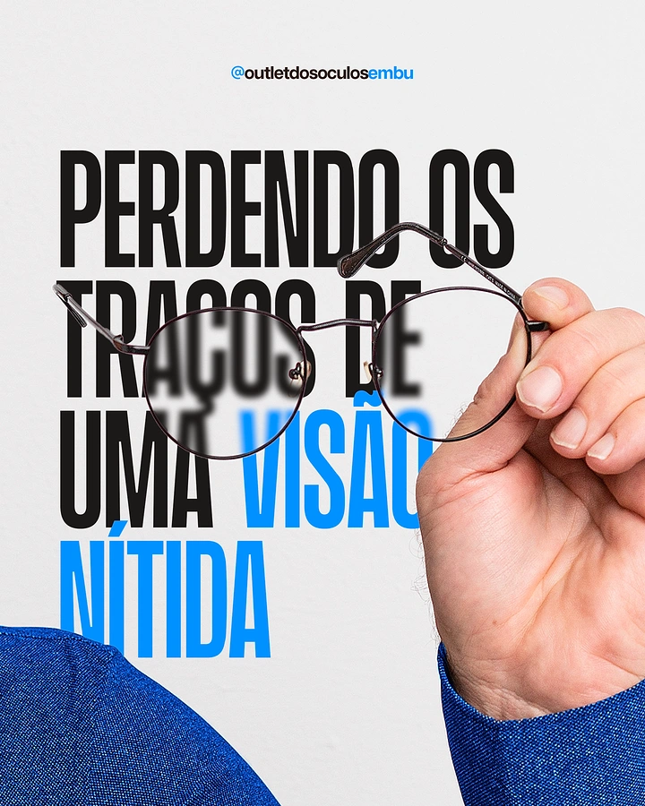 Creative ad: Hand holding round metal eyeglasses over blurred headline text