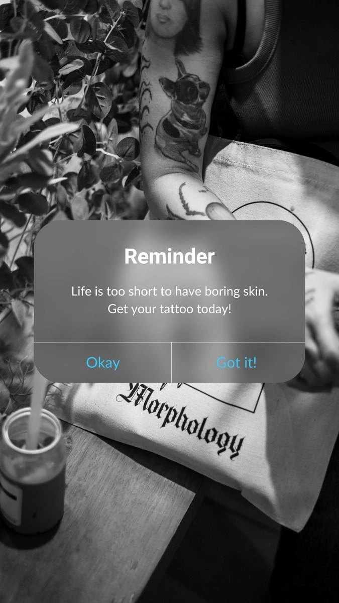 Tattoo Studios creative ad: Phone reminder pop-up as tattoo nudge