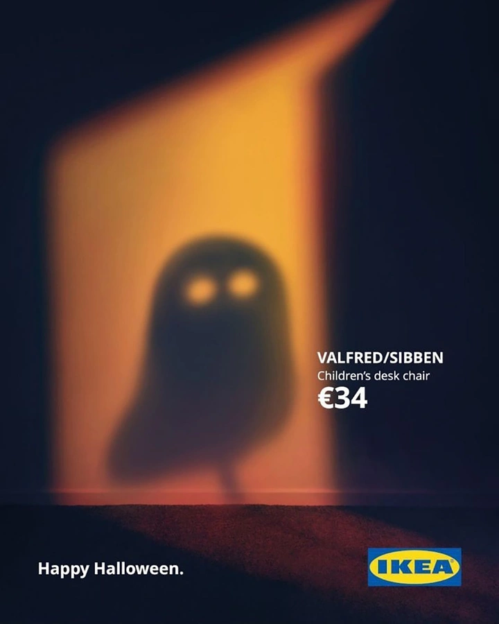 Halloween creative ad: Chair shadow forming a ghost in a lit doorway