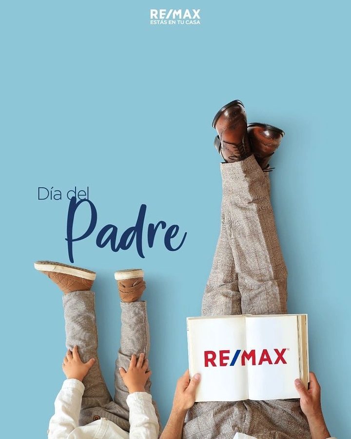 Father's Day creative ad: Father and child lying with legs raised, father holding open book