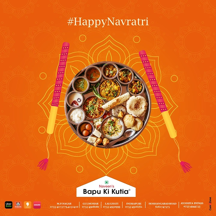 Navratri creative ad: Top-down vegetarian thali between dandiya sticks