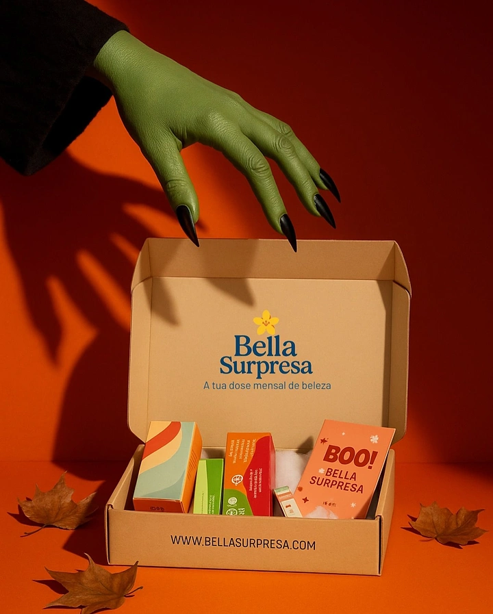 Halloween creative ad: Green witch hand reaching into an open beauty subscription box