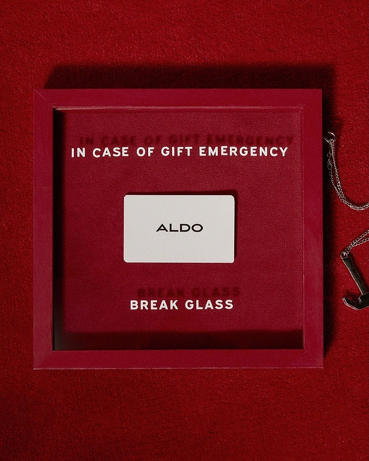 Christmas creative ad: Gift card inside a red 'break glass' emergency case