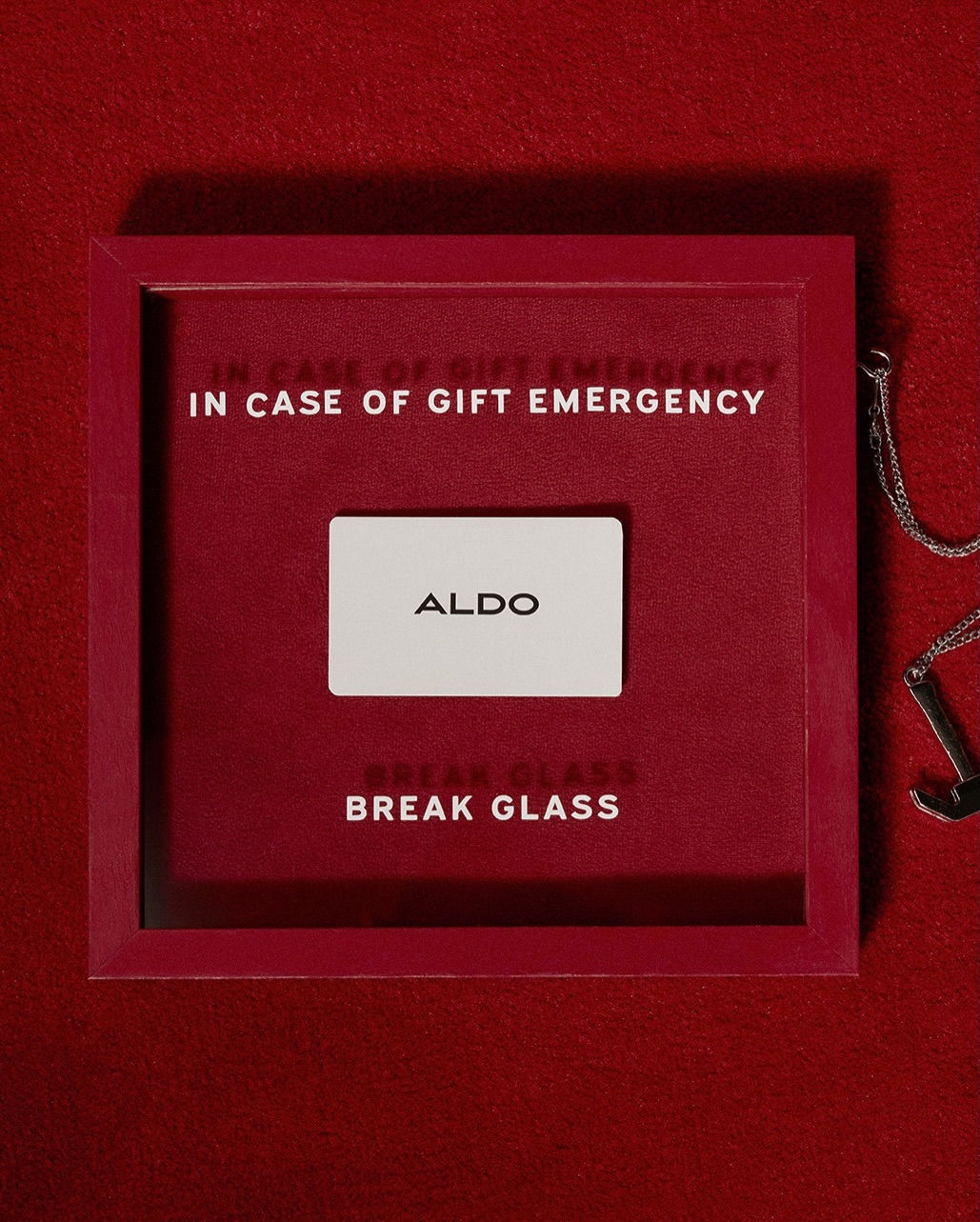 Christmas Carousel: Gift card inside a red 'break glass' emergency case, slide 1
