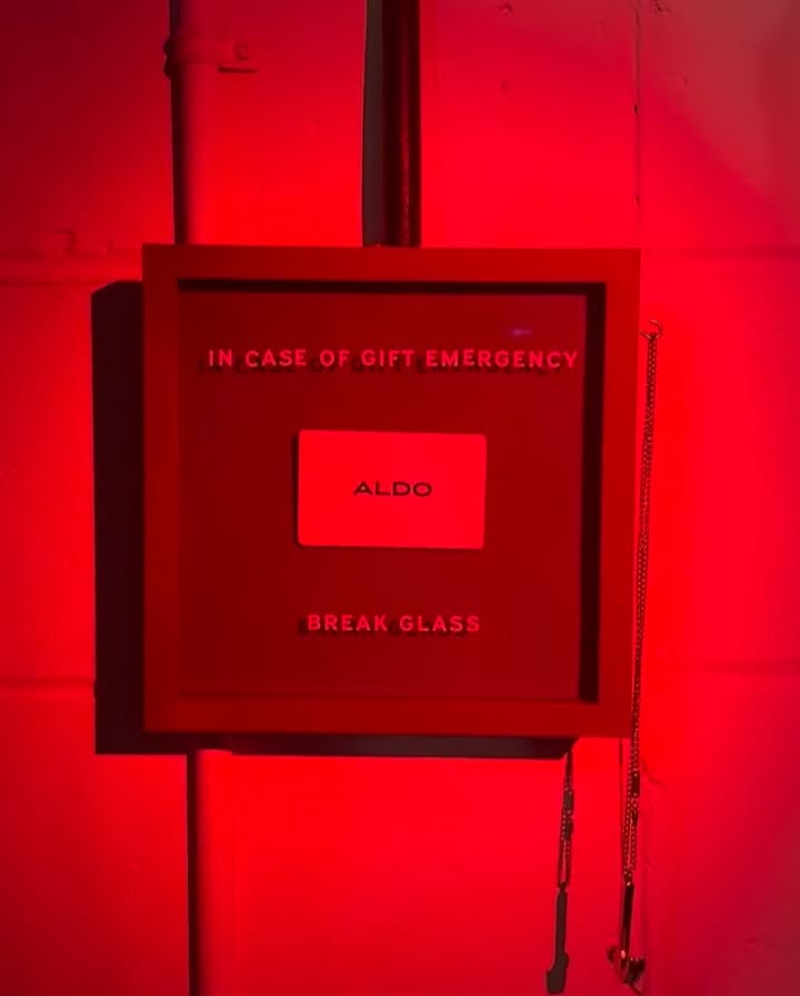 Christmas Carousel: Gift card inside a red 'break glass' emergency case, slide 2