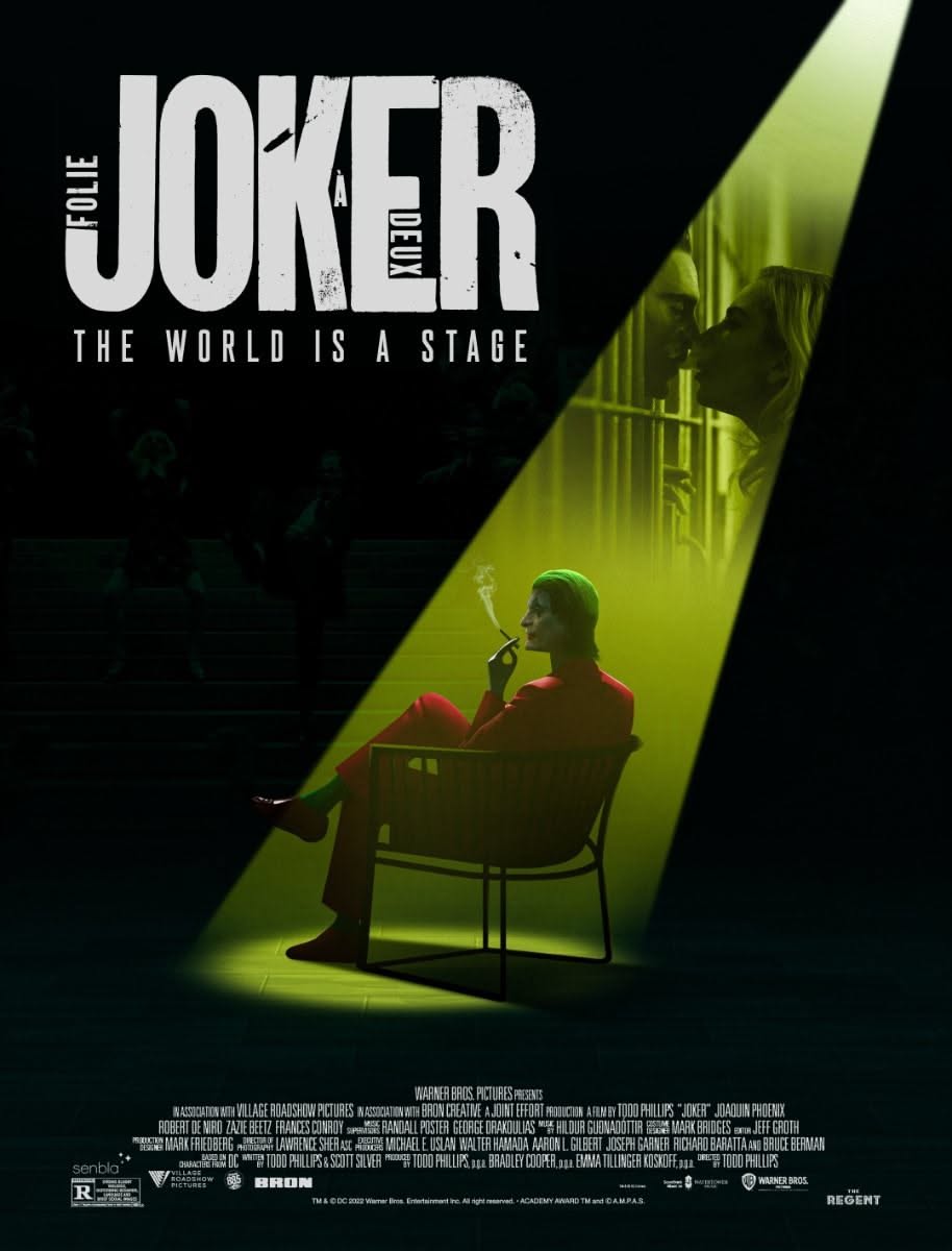Poster: Clown figure in red suit seated in a green spotlight