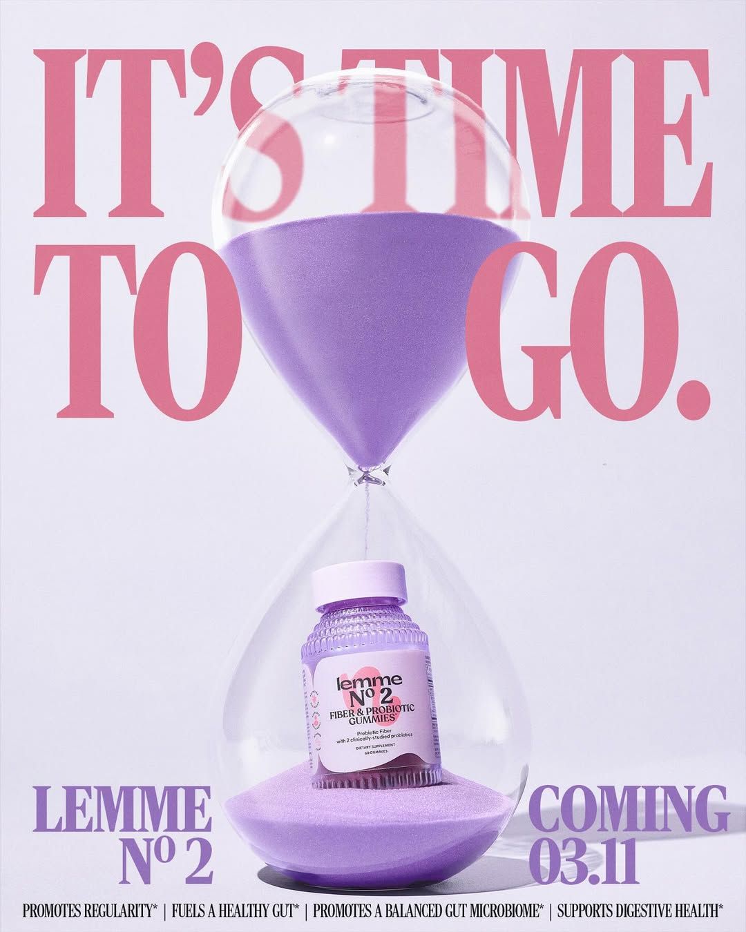 Instagram post: Gummy supplement bottle sitting inside an hourglass on lavender sand