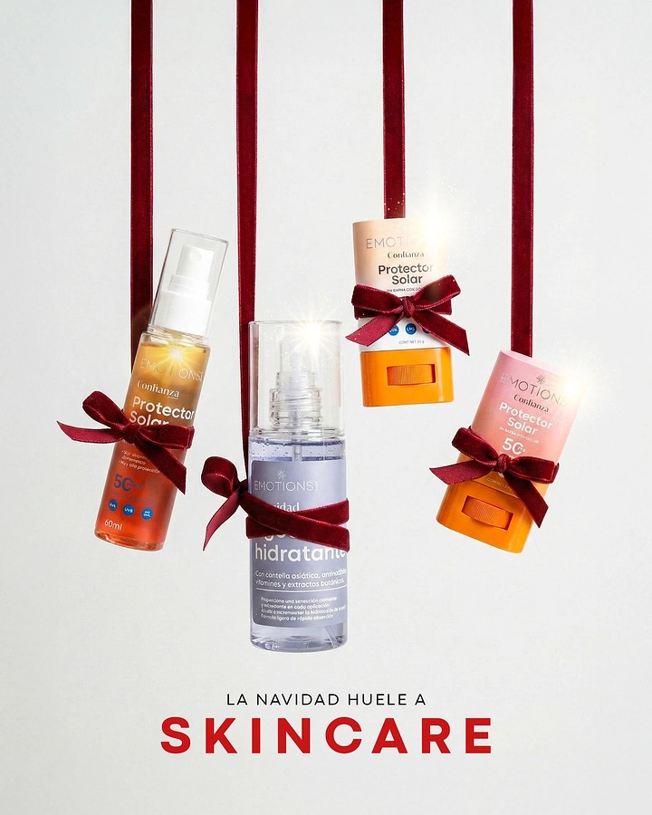 Christmas creative ad: Sunscreen and mist bottles hanging from red velvet ribbons like ornaments