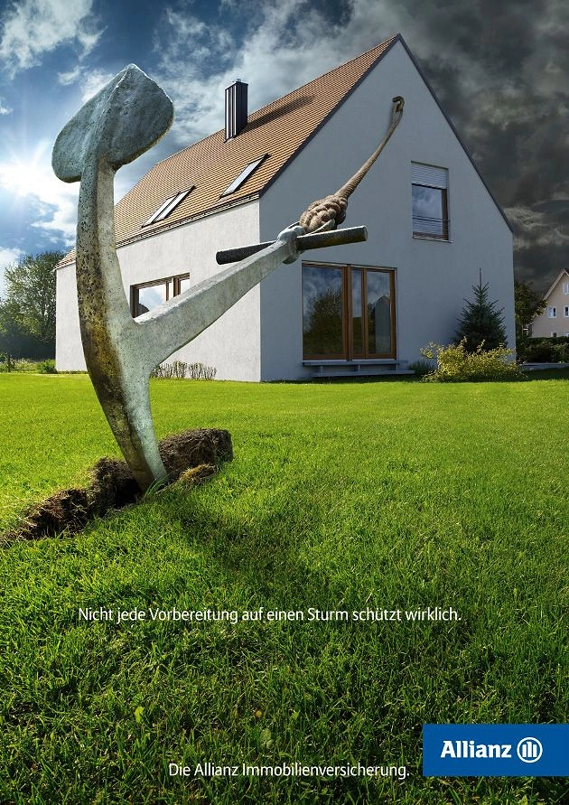 Insurance creative ad: Giant ship anchor dug into a lawn, roped to a house