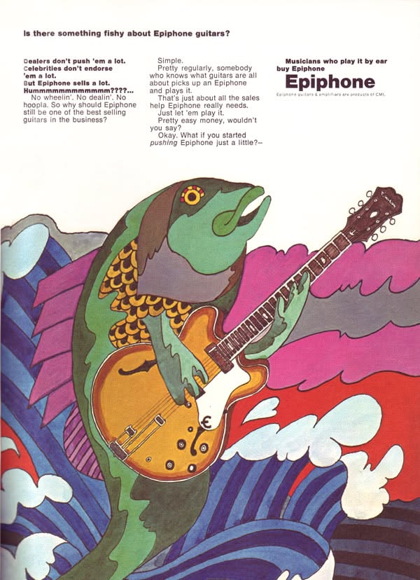 Carousel: A green fish musician playing an electric guitar