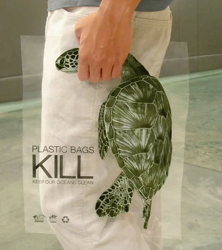 Creative ad: Transparent plastic bag printed with a sea turtle appearing trapped in a hand's grip