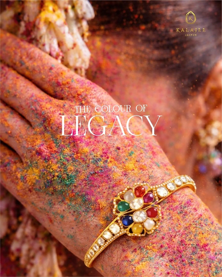 Holi creative ad: Close-up of a gulal-dusted hand wearing a gold navratna flower bangle